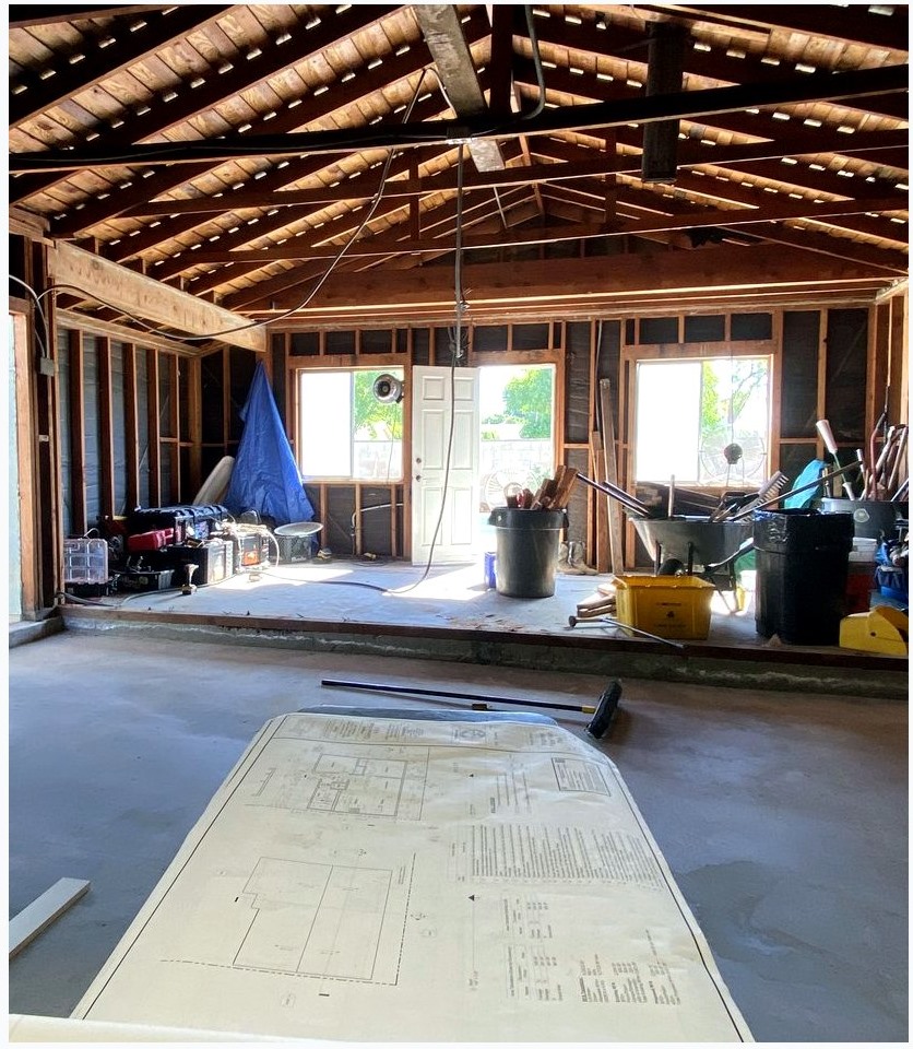 Open framed room with natural light during an ADU-style remodel
